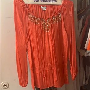 Beautiful orange tunic with some sparkling details